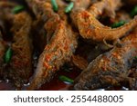 Spicy fried catfish (Balinese spiced catfish), home cooking, close up photo, selective focus.