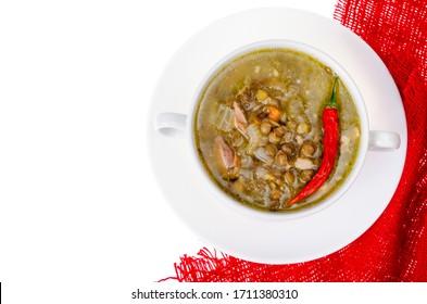 Spicy Green Lentil Chili Soup On White Plate. Studio Photo