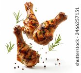 Spicy grilled chicken legs or drumsticks flying with herbs and spices. Floating BBQ chicken drumsticks with vegetables isolated on white background. Chicken drumsticks flying in air isolated on white