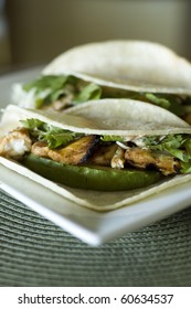 Spicy Grilled Fish Taco With Chipotle Lime Dressing On A White Corn Tortilla