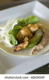 Spicy Grilled Fish Taco With Chipotle Lime Dressing On A White Corn Tortilla