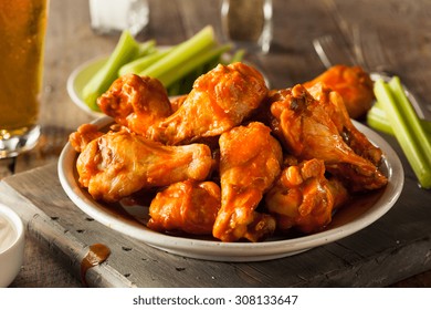 Spicy Homemade Buffalo Wings with Dip and Beer - Shutterstock ID 308133647