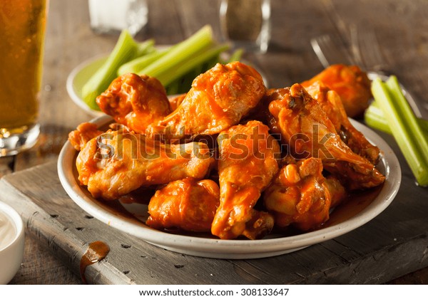 Spicy Homemade\
Buffalo Wings with Dip and\
Beer