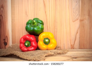 spicy hot peppers on wood background