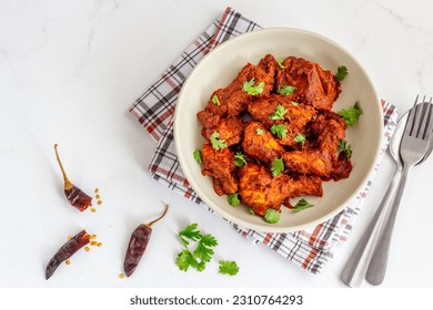 Spicy Indian Stir-Fried Chicken in a Bowl Top Down Photo on White Background - Shutterstock ID 2310764293