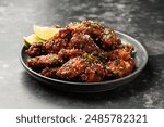 Spicy korean chicken wings with sesame seeds and chives