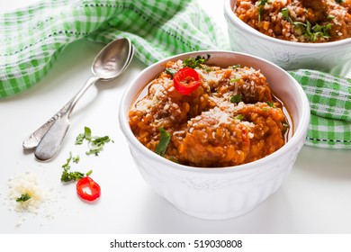 Spicy Lentil And Meatball Soup With Parmesan Cheese In Bowls On White Table.