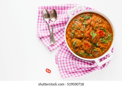 Spicy Lentil And Meatball Soup With Parsley. Casserole On White Table, Top View.