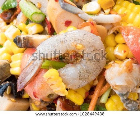 Spicy papaya corn salad with shrimp and fresh crab, Papaya corn salad is the most popular of women in Thailand.