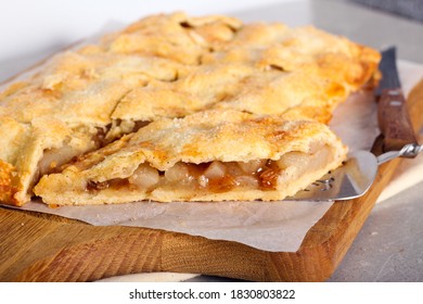 Spicy Pear And Raisin Pie, Sliced On Board