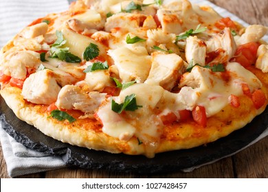 Spicy Pizza With Chicken, Tomatoes, Buffalo Sauce And Cheese Close-up On The Table. Horizontal
