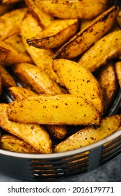 Spicy Potato Wedges In An Air Fryer Basket