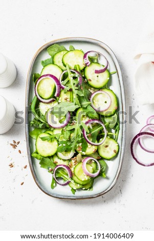 Spicy raw cucumber onion salad. Space for text, top view.