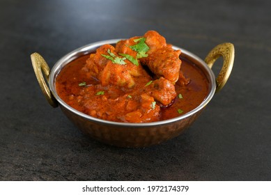 Spicy red chicken curry. Goan style chicken vindaloo. Butter chicken Murgh Makhani curry roast hot and spicy gravy dish Dhaba Punjab, India. North Indian non-vegetarian cuisine Garam Masala. tikka