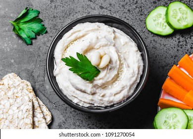 Spicy Ricotta White Bean Dip On Dark Concrete Background. Top View, Space For Text. 