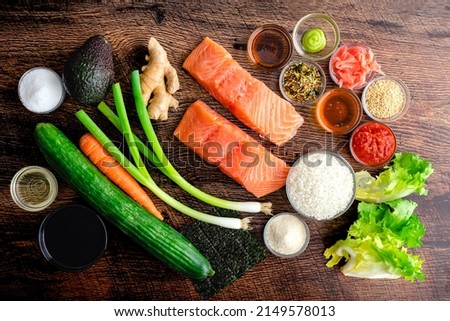 Spicy Salmon Sushi Bowl Ingredients: Raw salmon, sushi rice, vegetables, and other ingredients