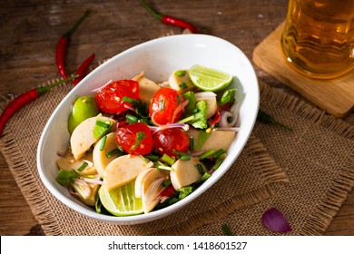 Spicy Salted Egg Yolk Salad In White Bowl On Wood Background