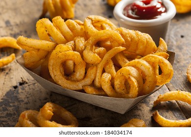 Spicy Seasoned Curly Fries Ready to Eat - Powered by Shutterstock