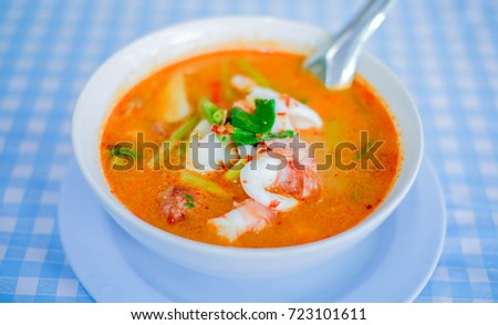 Spicy soup with shrimps and quids.