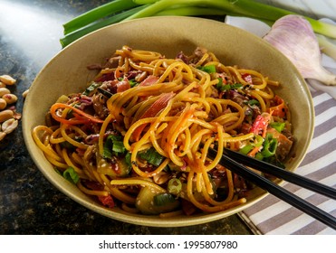 Spicy Thai chicken peanut butter lo mein noodles with tuxedo sesame seeds