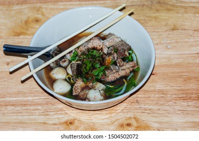 Spicy TOM YAM pork noodle soup with lemongrass, chilly pasted and lime juice - Shutterstock ID 1504502072