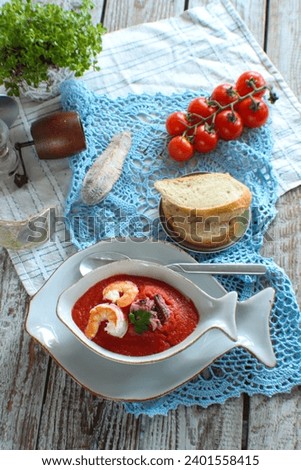 spicy tomato puree soup with shrimp and squid