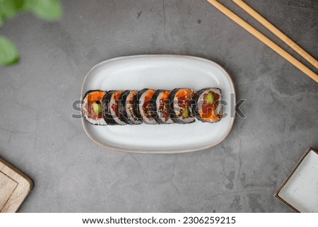 spicy tuna sushi roll. with avocado and cucumber. Top view . Flatlay. Japanese traditional food and cooking  concept. 