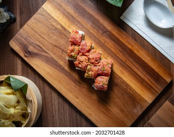 Spicy Tuna Ura Maki On Wooden Plate