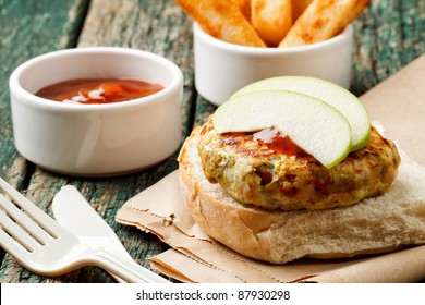 Spicy Turkey Burger On A Wooden Background