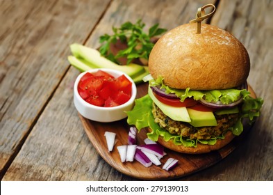 spicy vegan curry burgers with millet, chickpeas and herbs. the toning. selective focus - Powered by Shutterstock