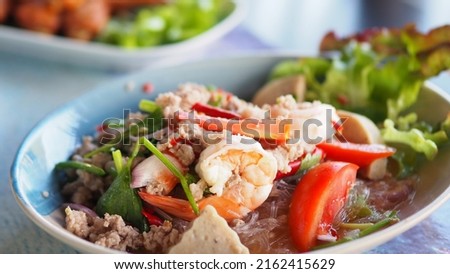 Spicy Vermicelli Seafood Salad with vegetable ingredient Thai food Street food Concept.