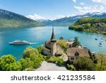 Spiez castle with cruise ship on lake Thun in Bern, Switzerland.