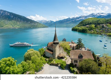Spiez castle with cruise ship on lake Thun in Bern, Switzerland.