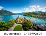 Spiez castle on lake Thun in Spiez in the Bernese Oberland of Switzerland. Landscape and nature travel, or historical building and sightseeing concept