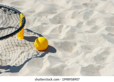Spike Ball Game With Yellow Ball On Sand. Summer Game Concept