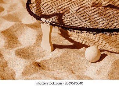 Spike Ball Game With Yellow Ball On Sand. Summer Game Concept. Brown Color Filter