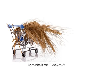 Spikelets Of Wheat In A Supermarket Trolley. Food Security, Crisis. White Isolated Background.