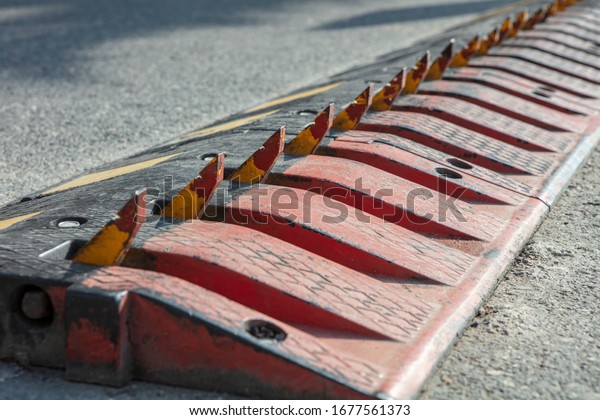 Spikes barrier are frequently used\
to enforce a directional flow in a single traffic lane.\

