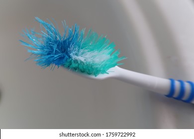 Spiky Worn Old Teal Toothbrush Waiting to be Used