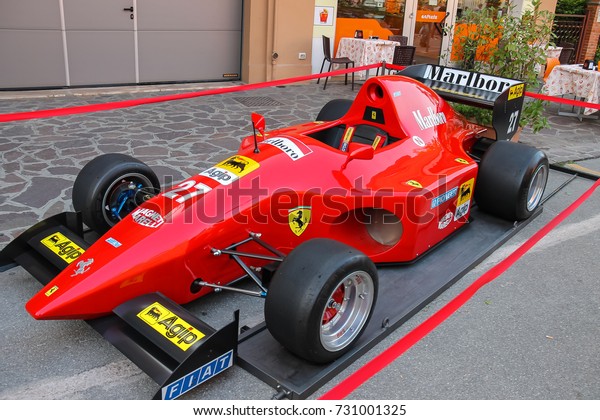Spilamberto, Italy- October 02,\
2016: Exhibition of vehicles from Ferrari Museum on streets of\
Spilamberto