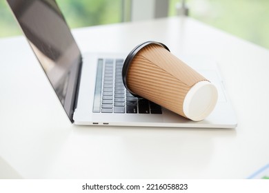 Spill Coffee From Paper Glass On Computer Laptop Keyboard