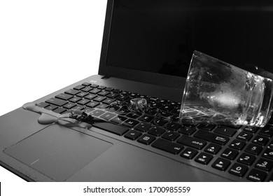 Spill A Glass Of Water On A Laptop. Causing The Laptop To Fail