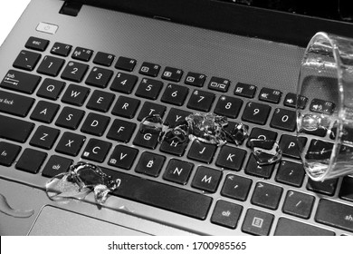 Spill A Glass Of Water On A Laptop. Causing The Laptop To Fail