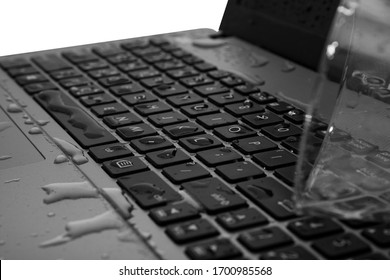 Spill A Glass Of Water On A Laptop. Causing The Laptop To Fail