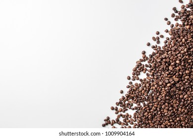 Spilled Coffee In Grains And Big White Background As Space For Text