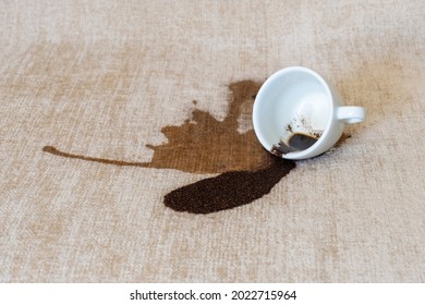 Spilled Cup Of Coffee On The Sofa With Dirty Stain.