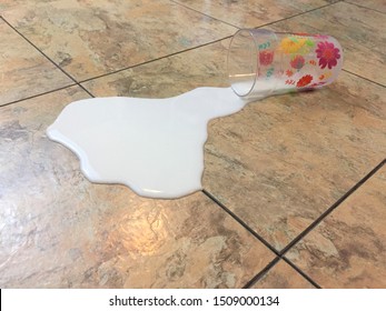 Spilled Cup Of Milk On The Floor