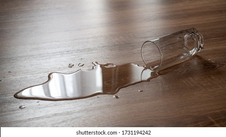 Spilled glass of water on a laminate