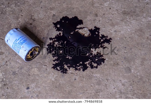 Spilled motor oil on the\
floor