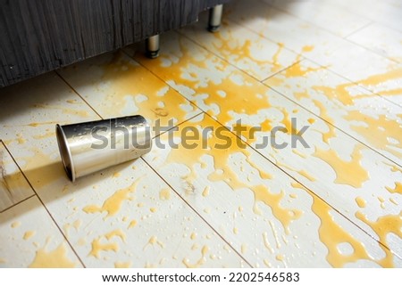 Spilled out drink on the floor closeup photo